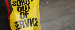 Parking meter with 'sorry - out of service' cover
